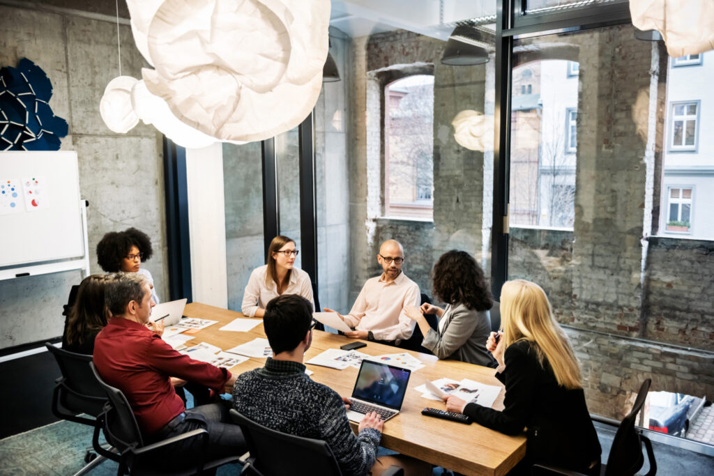 people sitting around a table at an office